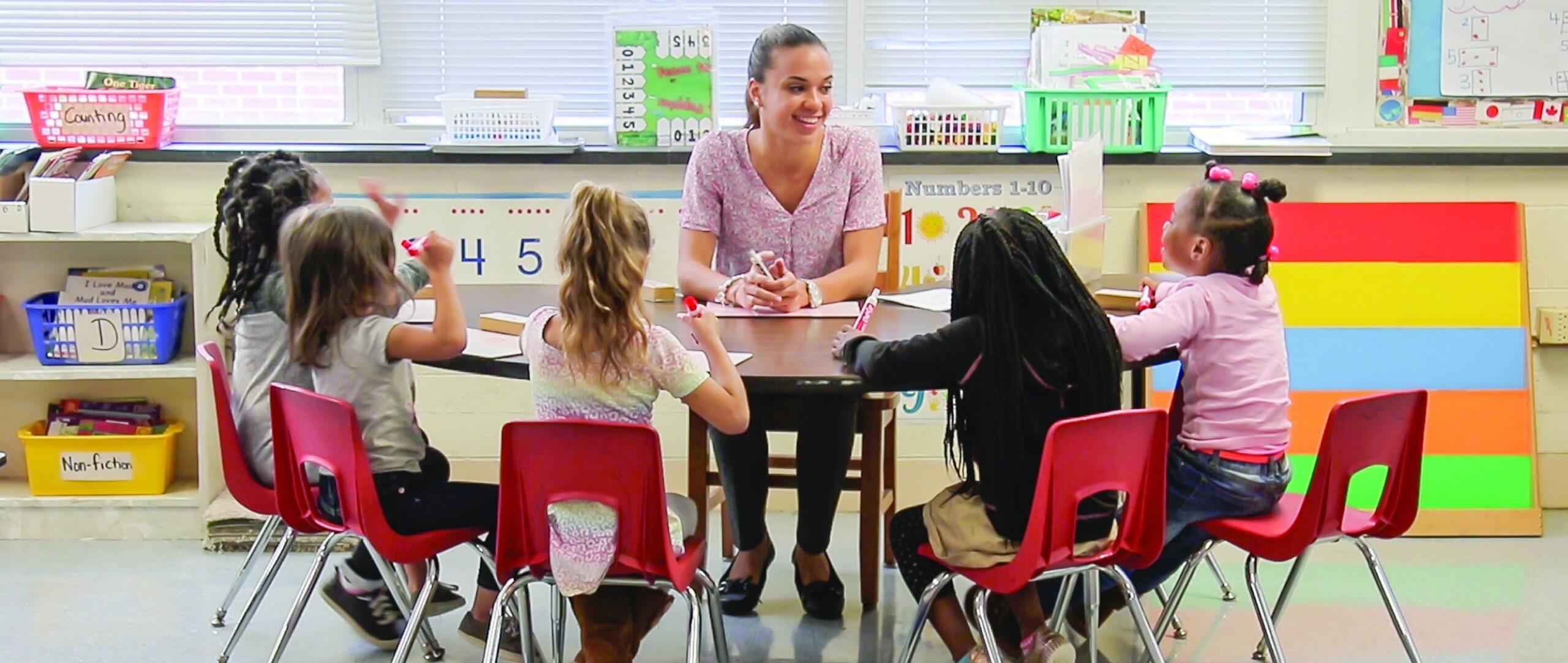A global leaders educator teaching elementary students durable skills