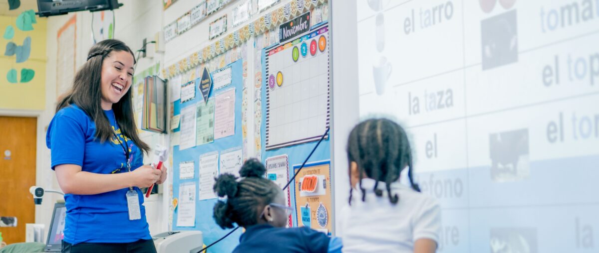 Dual language teacher teaching Spanish to a student