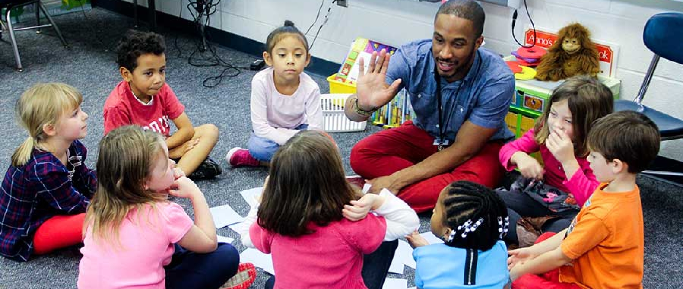 An Ambassador Teacher encourages global competence in students by giving them high fives