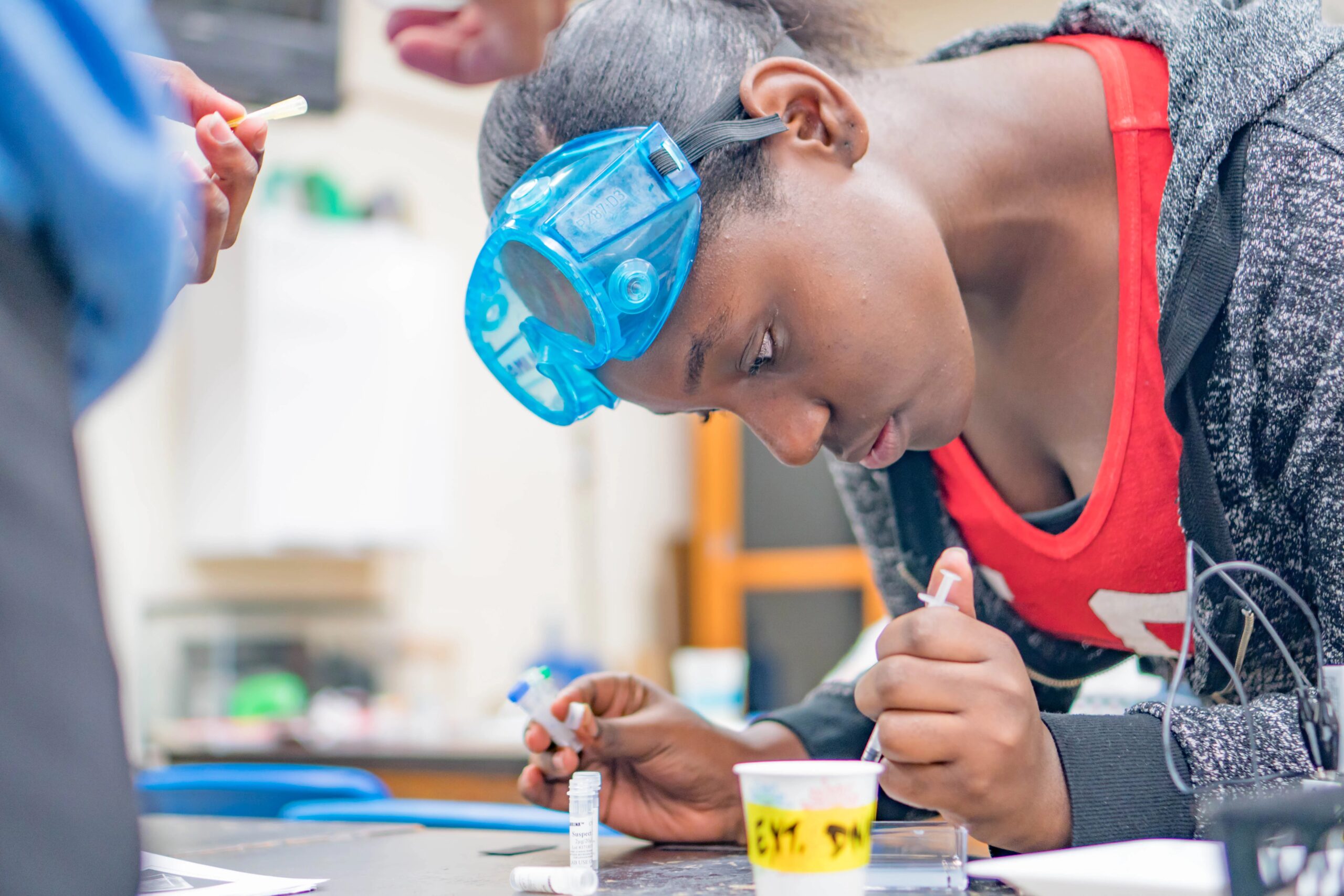 A student learning about global education through project-based learning with a lab experiment