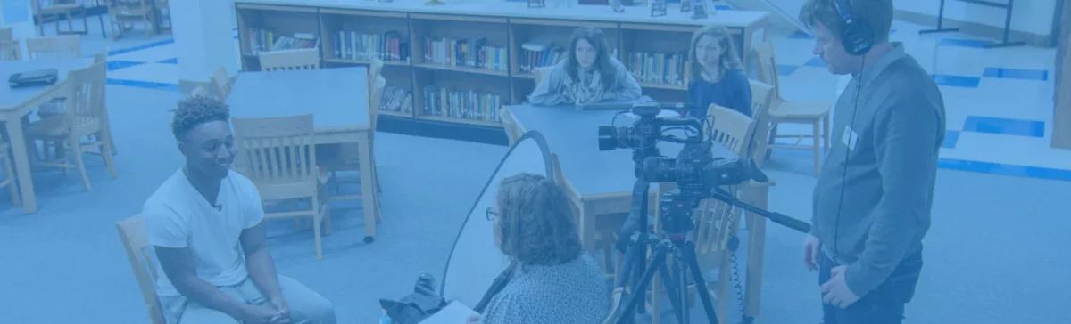 The press interviewing a student at a Participate Learning Partner School about dual language and global competence