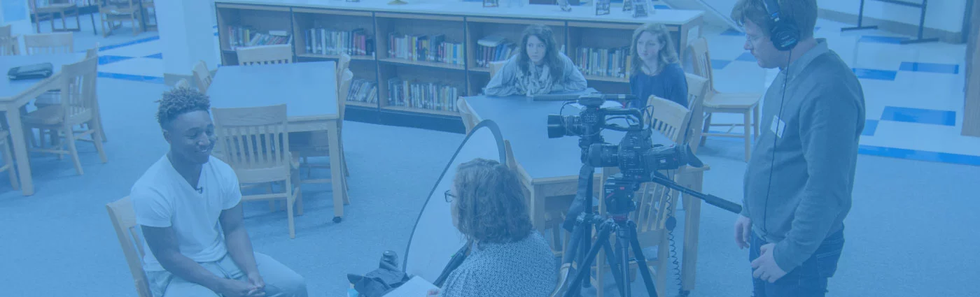 The press interviewing a student at a Participate Learning Partner School about dual language and global competence