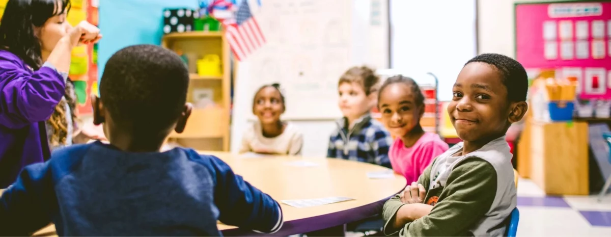 Students smile as they learn about global education from an Ambassador Teacher