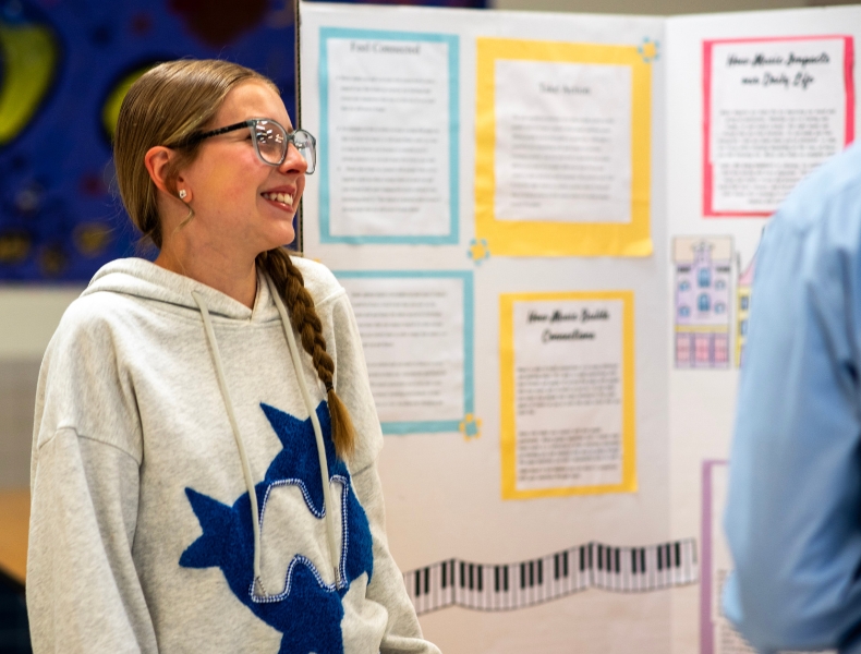 A Global Leaders middle school student presenting a project and practicing communication skills