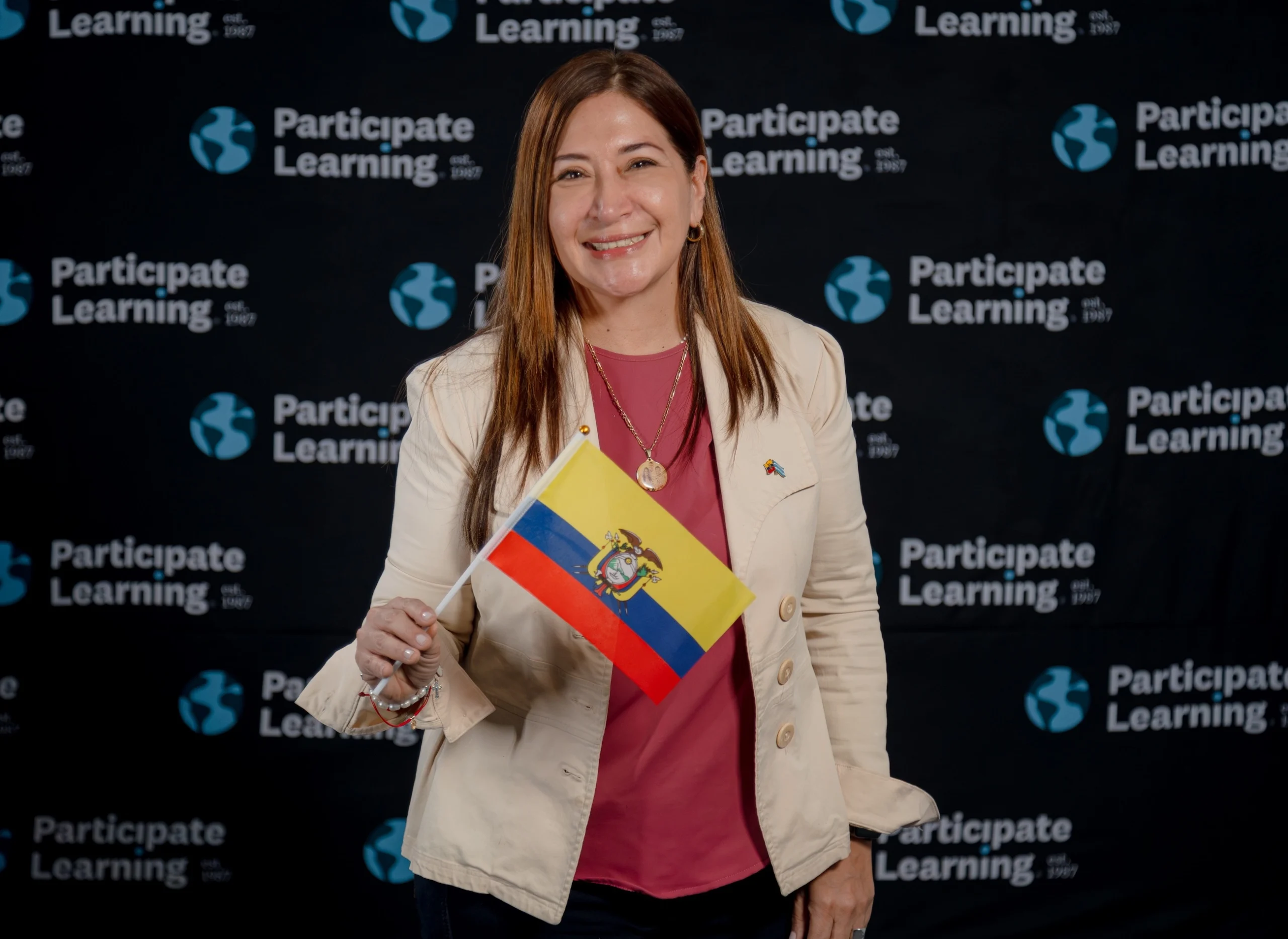 Teachers from Ecuador smile during Participate Learning orientation, celebrating the start of their cultural exchange program in the United States.