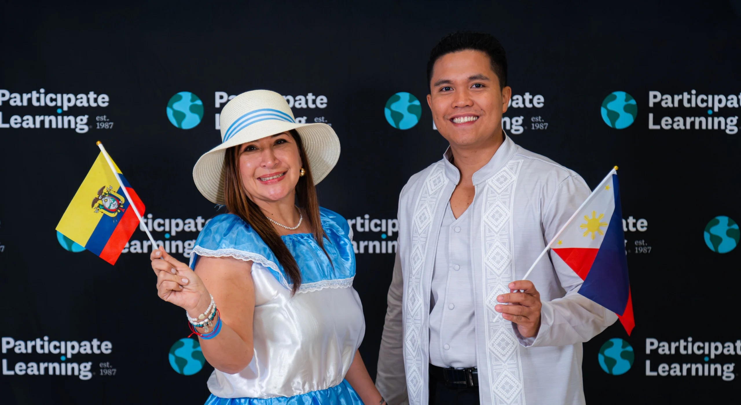 Teachers from Ecuador pose together during the Participate Learning exchange program orientation, representing their home country with pride.