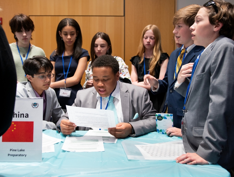 A group of students at the Conexiones para la Acción Diplomática event at UNC Greensboro