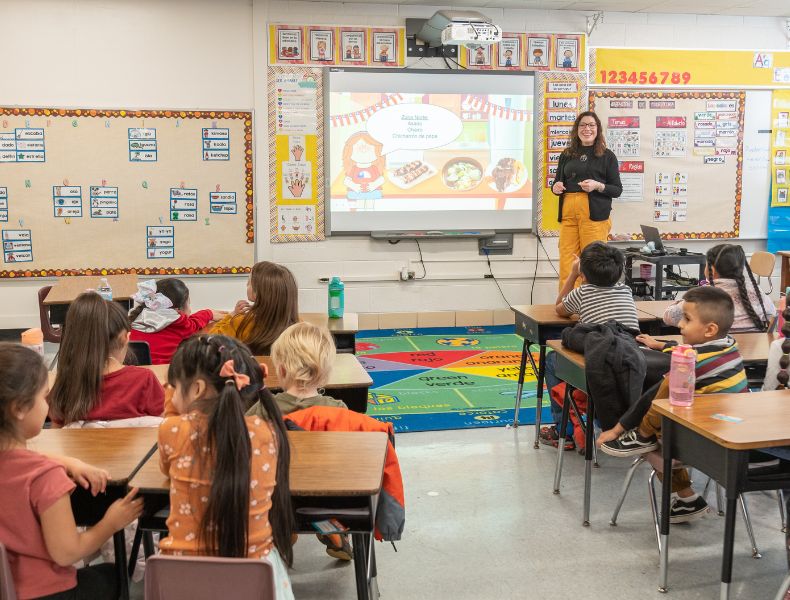 A teacher leads a lesson in a dual language elementary classroom.