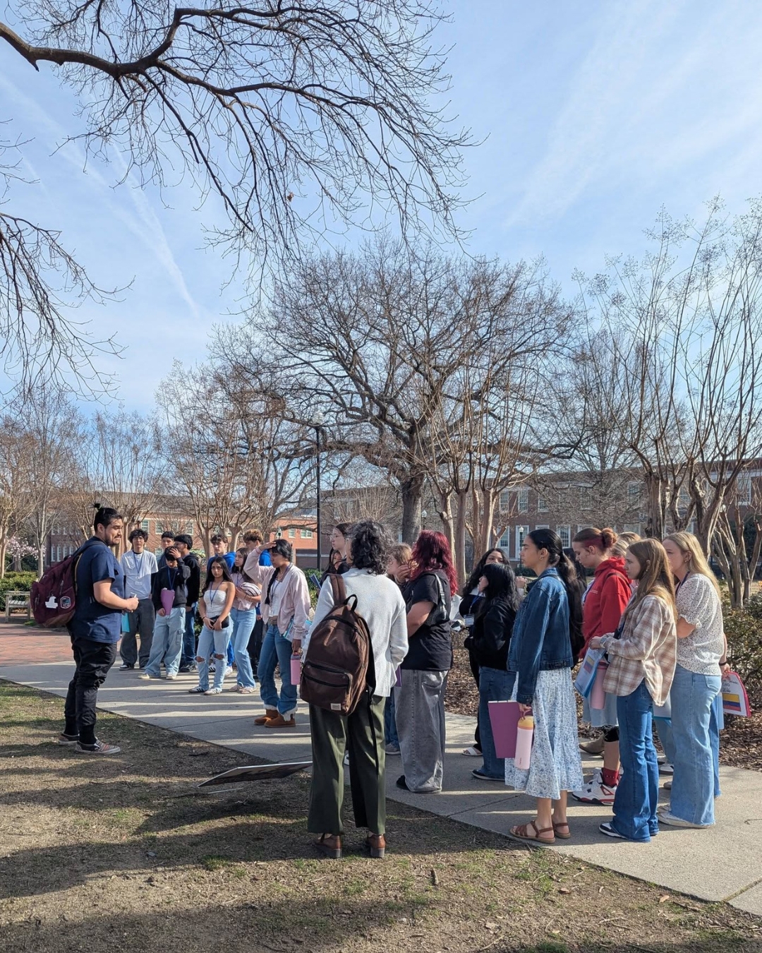 A group of Conexiones middle school students on a tour of UNCG's campus 