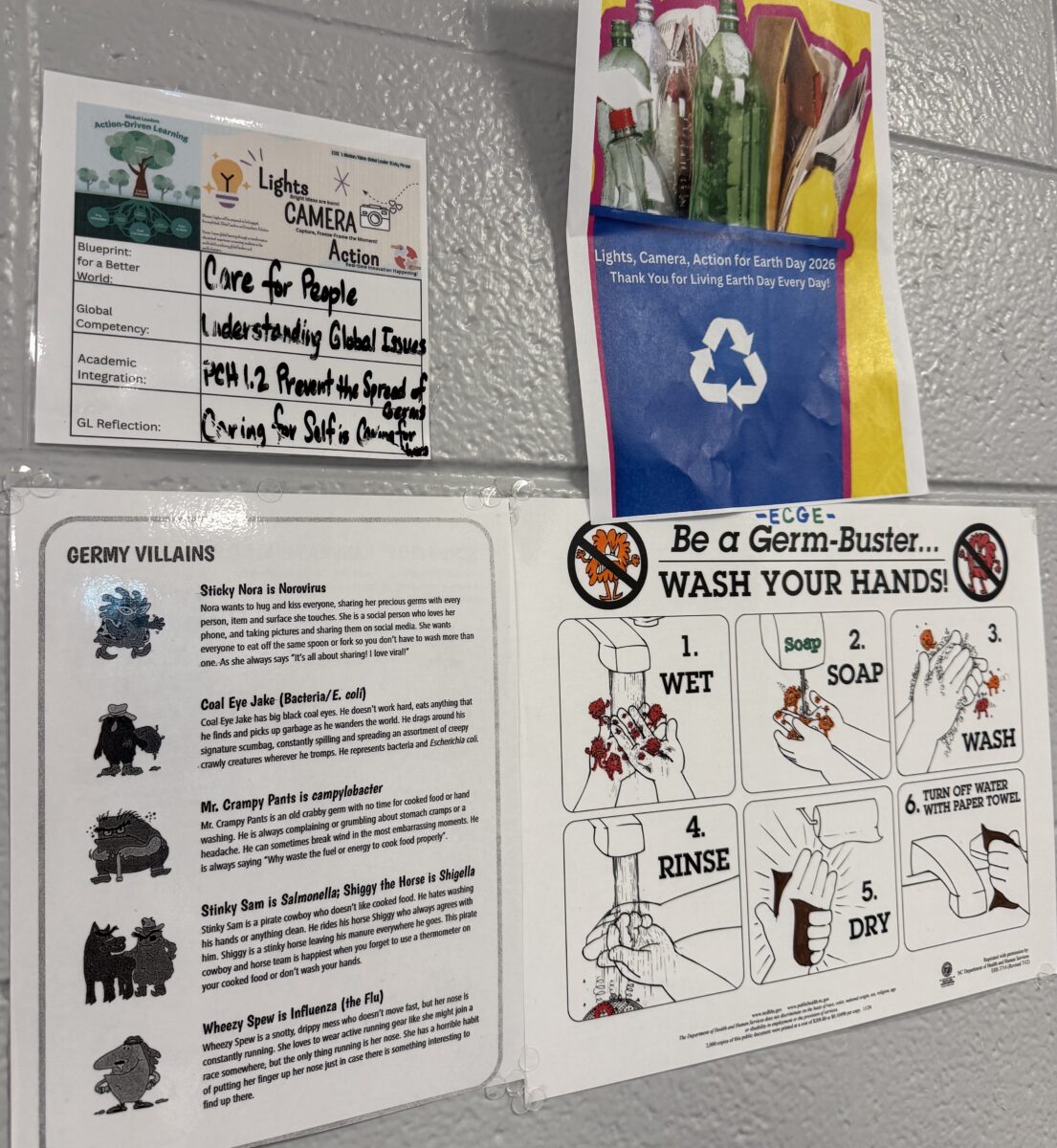 Classroom posters on recycling and handwashing, connecting global learning to real-world health and environmental responsibility.