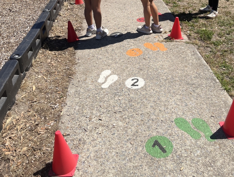 Students use a peace path on the playground at Belvoir Elementary School to practice conflict resolution and communication skills.