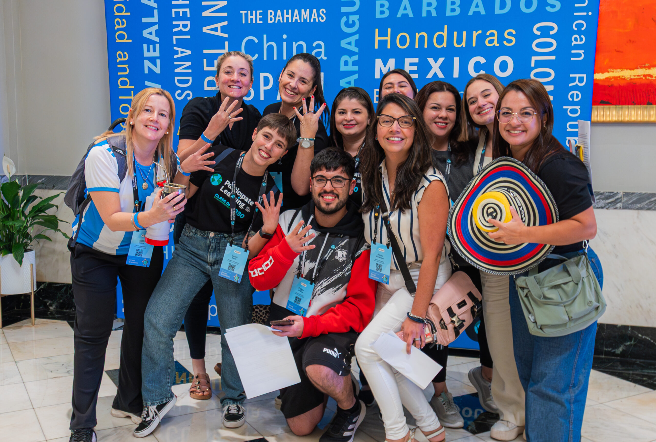 A group of Participate Learning Ambassador Teachers posing for a photo at Arrival Orientation